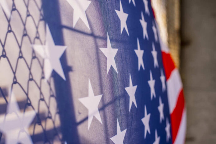Illegal,Immigration,Concept,Background,Of,Transparent,American,Flag,Behind,A