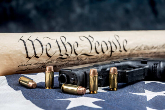 A,Handgun,With,Bullets,Symbolizing,Gun,Rights,While,Framed,Against
