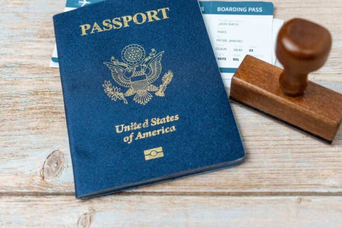 Us,Passport,And,Stamp,On,Wooden,Background.,Safe,Journey,With