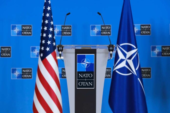 Us,Flags,Stand,In,Press,Room,At,The,Nato,Headquarters