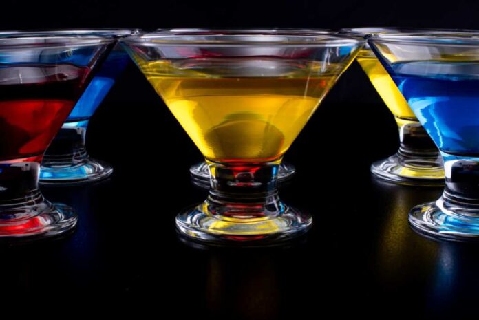 Glass,Cups,Of,Multi-colored,Jell-o,On,A,Dark,Background