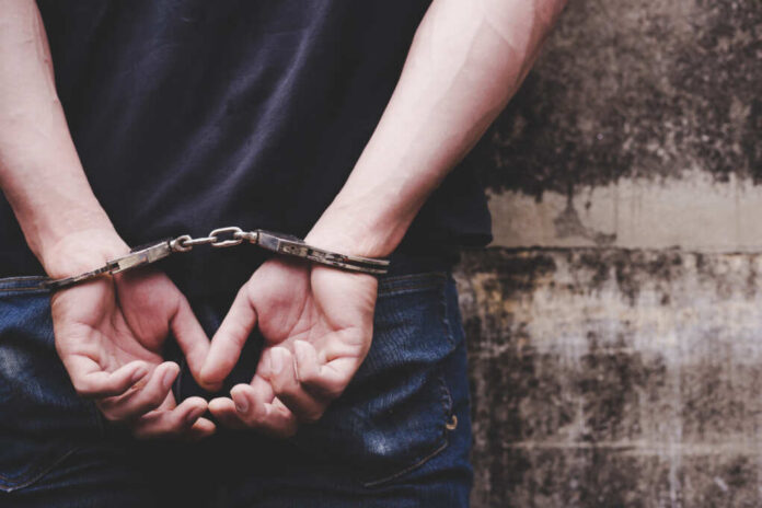 Thief,Under,Arrest,And,Get,Cuffed,By,Policeman,Bad,Person
