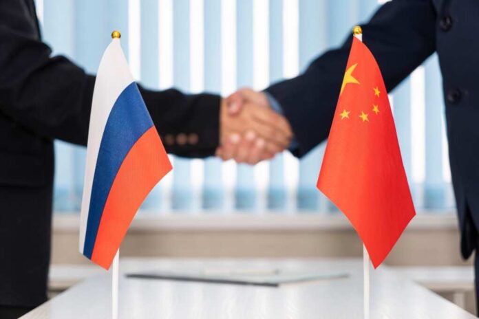 Political,Flags,Of,Russia,And,Chinese,On,Table,In,International