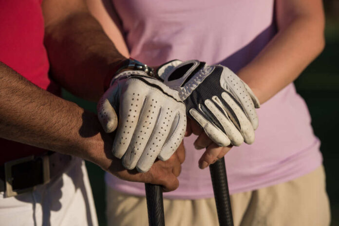 Portrait,Of,Happy,Young,Couple,On,Golf,Course