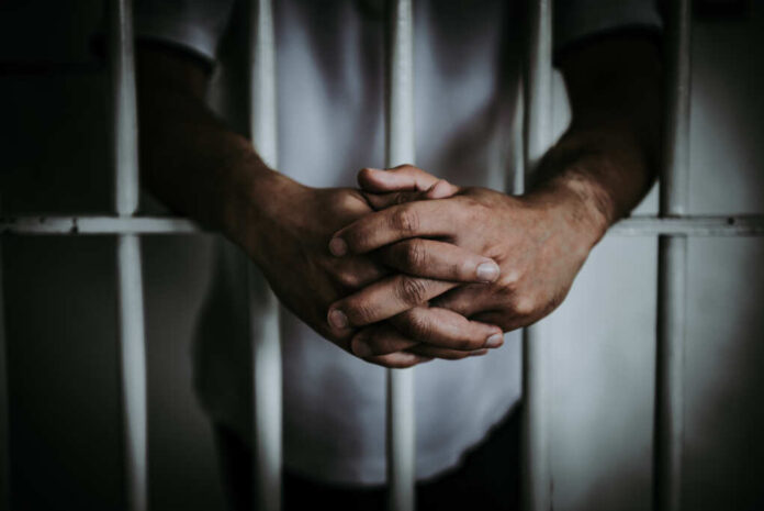 Hands,Of,Men,Desperate,To,Catch,The,Iron,Prison,prisoner,Concept,thailand
