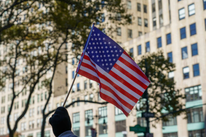 Man,Is,Holding,Us,Falg,On,New,York,City,Veterans