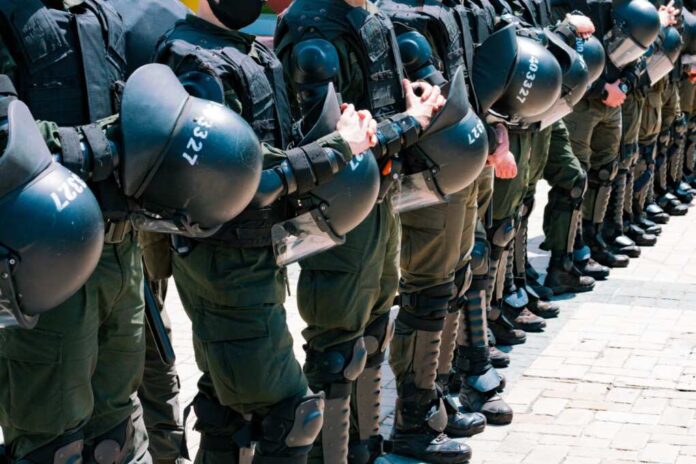 A,Row,Of,Armed,Special,Police,Forces,With,Helmets,Stands