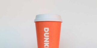 Orange coffee cup with Dunkin' logo