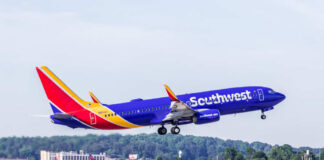 A Southwest Airlines airplane taking off from an airport runway