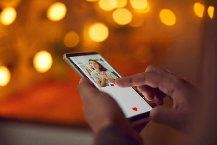 Person using a smartphone to interact with a dating app