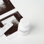 Ultrasound images and a bottle of misoprostol next to a pregnancy test