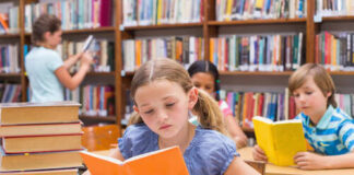 Children reading books in a library