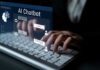 Person typing on a keyboard with a digital AI chatbot interface displayed