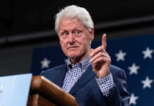 Former president gesturing while speaking at an event