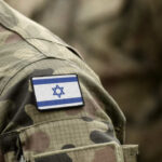 Close-up of a military uniform with an Israeli flag patch