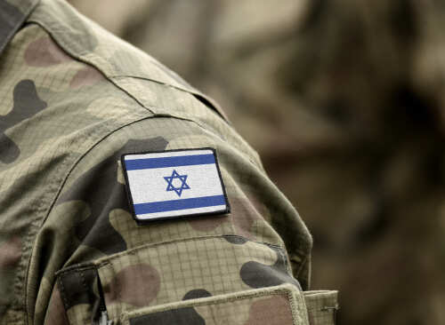 Close-up of a military uniform with an Israeli flag patch