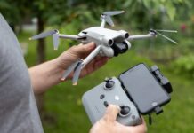 DJI’s Market Supremacy: A Hidden Threat Emerges Person holding a drone and its remote control outdoors