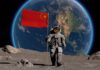 An astronaut on the moon holding a Chinese flag with Earth in the background