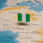 A small Nigerian flag placed on a map of Africa