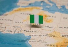 A small Nigerian flag placed on a map of Africa