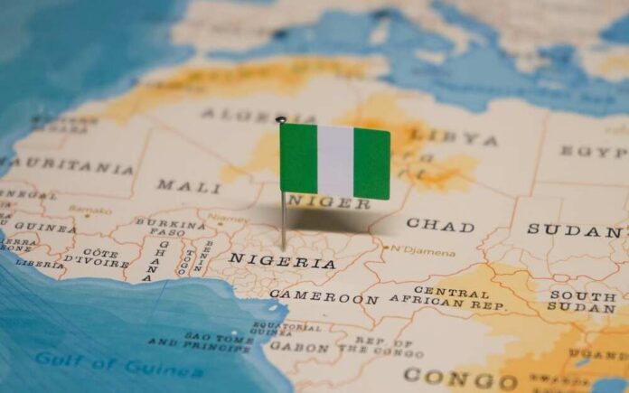 A small Nigerian flag placed on a map of Africa