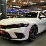 White Honda Civic displayed at a car exhibition