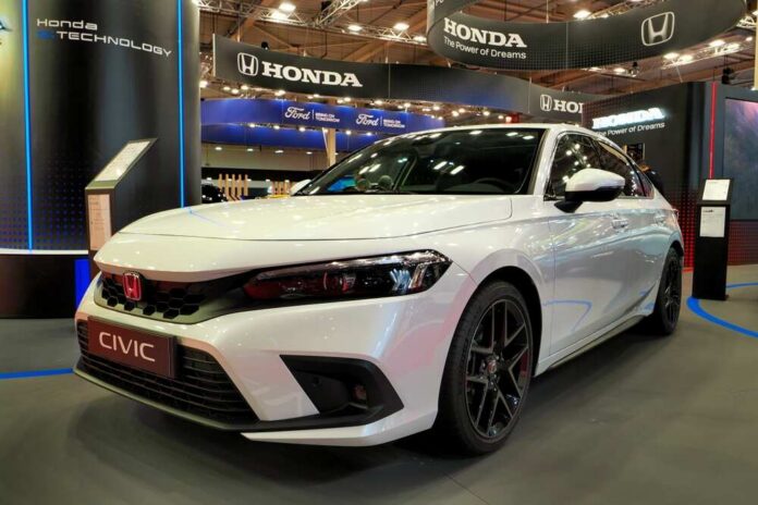 White Honda Civic displayed at a car exhibition