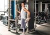 Woman stretching her leg in a gym setting