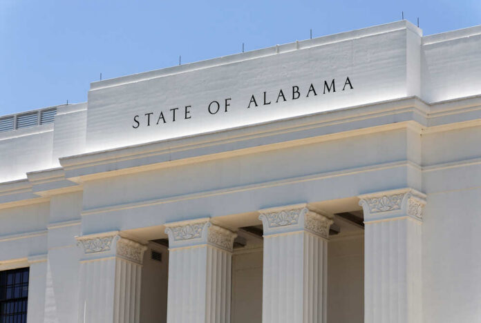 Facade of a government building with the words 'STATE OF ALABAMA' displayed prominently