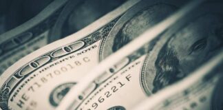 Close-up of folded hundred dollar bills