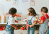 Parents ALERT: Social Media’s Dangerous Toy Dare Three children engaged in play with educational toys in a colorful classroom