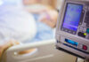 IV pump displaying medication flow rate in a hospital room