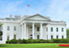 White House Fight Night: Patriotic or Problematic? The White House with an American flag flying above, surrounded by greenery