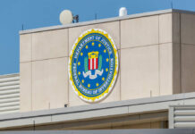 Army Base Targeted—ISIS-Inspired Attack STOPPED! FBI emblem displayed on the exterior of a government building