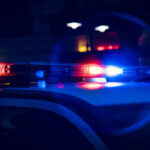 Close-up of police car lights flashing at night