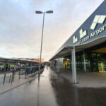 Exterior view of Luton Airport with a cloudy sky