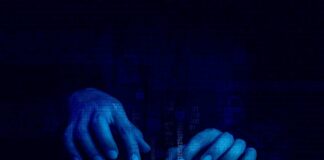 Hands typing on a keyboard with a digital binary background