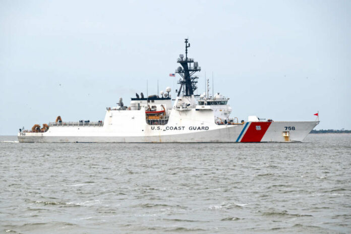 shutterstock_2426628529 U.S. Coast Guard patrol vessel navigating through the ocean