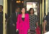 MISSING JFK FILES: A New CIA Scandal? Woman in a bright pink suit walking out of a building