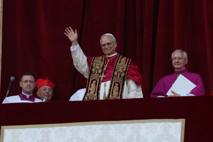 Rome,,Italy,08-05-2025:,The,New,Pontiff,Appears,On,The,Central Pope waving from a balcony during a public address