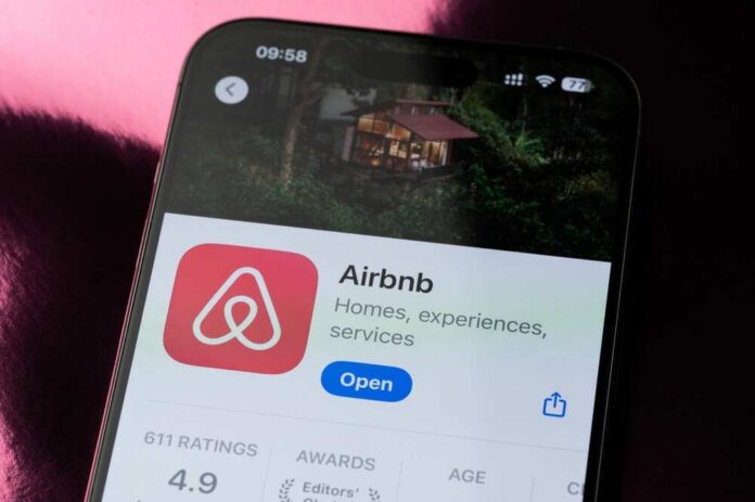 shutterstock_2646495041.jpg Airbnb app interface displayed on a smartphone screen