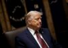 Trump’s Approval Crisis: What’s Really Happening? A political figure seated with a serious expression in a formal setting