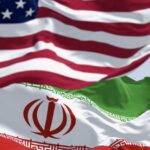 Nuclear Negotiations: Real Deal or Empty Talk? Flags of the United States and Iran waving together