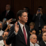Threat Case Teeters After Prosecutor Exit A man raising his right hand during a congressional hearing