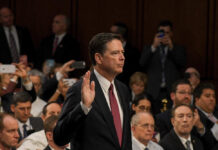 Threat Case Teeters After Prosecutor Exit A man raising his right hand during a congressional hearing