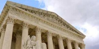 Supreme Court building with columns and statue