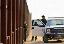 Terror Alarms Spike At Canada Border U.S. Customs and Border Protection officers near a border fence
