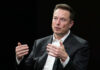 Confiscation Clash: Musk vs. Capitol Power A business leader speaking during an interview, using hand gestures for emphasis