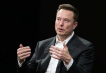 Confiscation Clash: Musk vs. Capitol Power A business leader speaking during an interview, using hand gestures for emphasis