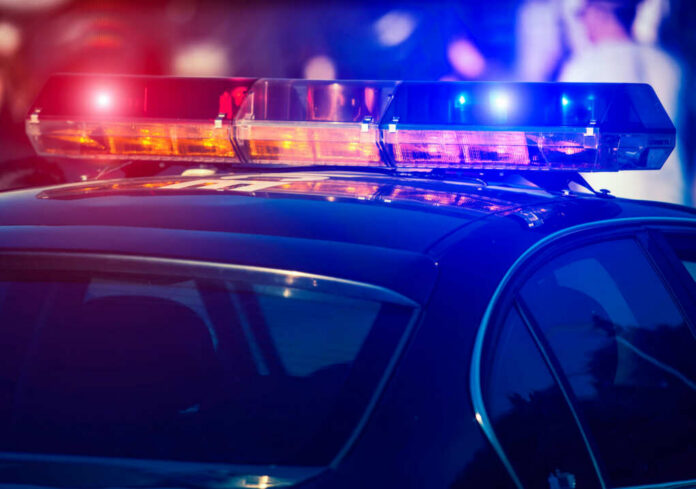 shutterstock_1823442731 Close-up of a police cars emergency lights
